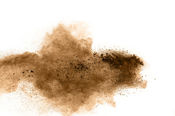 abstract brown dust explosion on white background.  Freeze motion of brown powder splash.