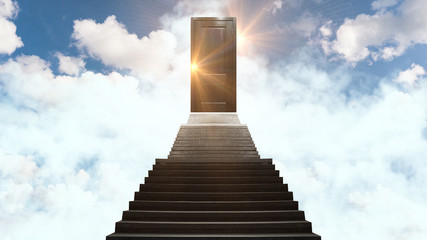 Closed door on the stairs at the top on the clouds, sunlight, magic