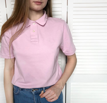 Girl In Pink Polo Shirt On White Background