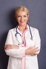 Smiling female doctor portrait. Studio shot