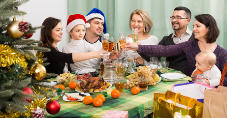 happy family celebrates Christmas at  table
