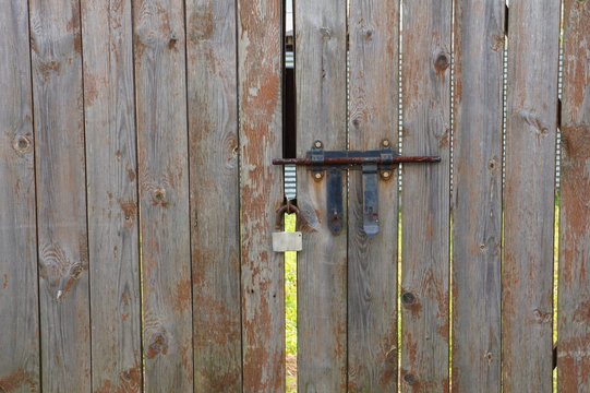 Fence. Gate with a lock and a bolt.