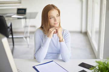 Thinking businesswoman portrait