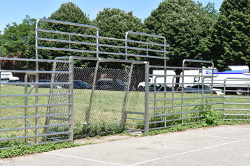 goal mouth of a rarely used mini-soccer pitch in the park surrounded by grass