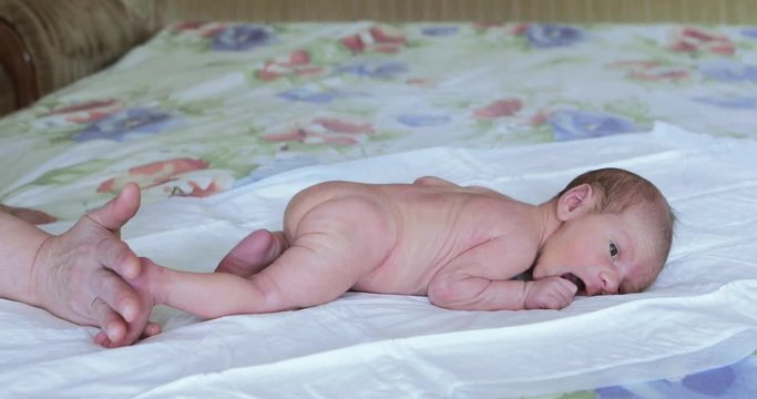 The baby boy lies on his stomach