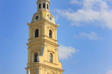 Fototapeta premium Peter and Paul Cathedral at Peter and Paul Fortress in Saint Petersburg, Russia. Close Up Detailed View of Beautiful Simple Bell Tower of Russian Orthodox Church. St. Petersburg City Sights on Summer.
