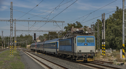 Fototapeta na wymiar Fast train in Karlovy Vary station in hot summer day