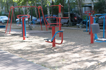 Exercise equipment in a public park in a sunny day