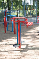 Exercise equipment in a public park in a sunny day