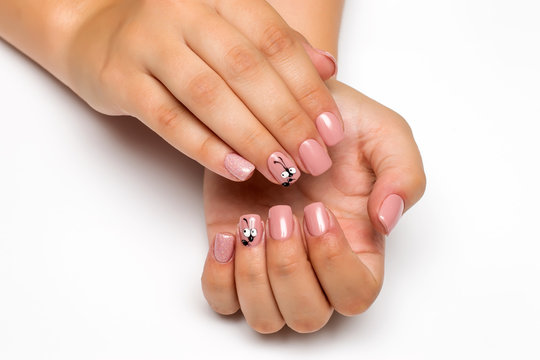 beige pink manicure with sequins and an ant on square short nails
