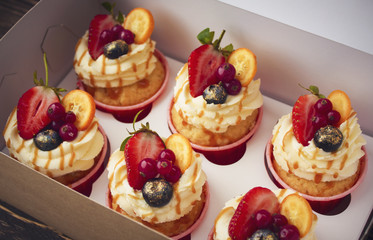 Vanilla cupcake with caramel and fresh berries