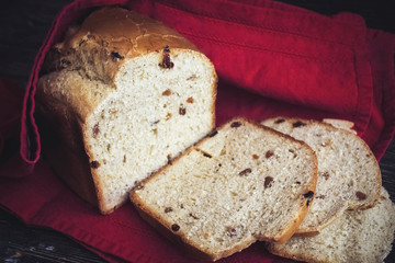 Sliced homemade bread on a red towel