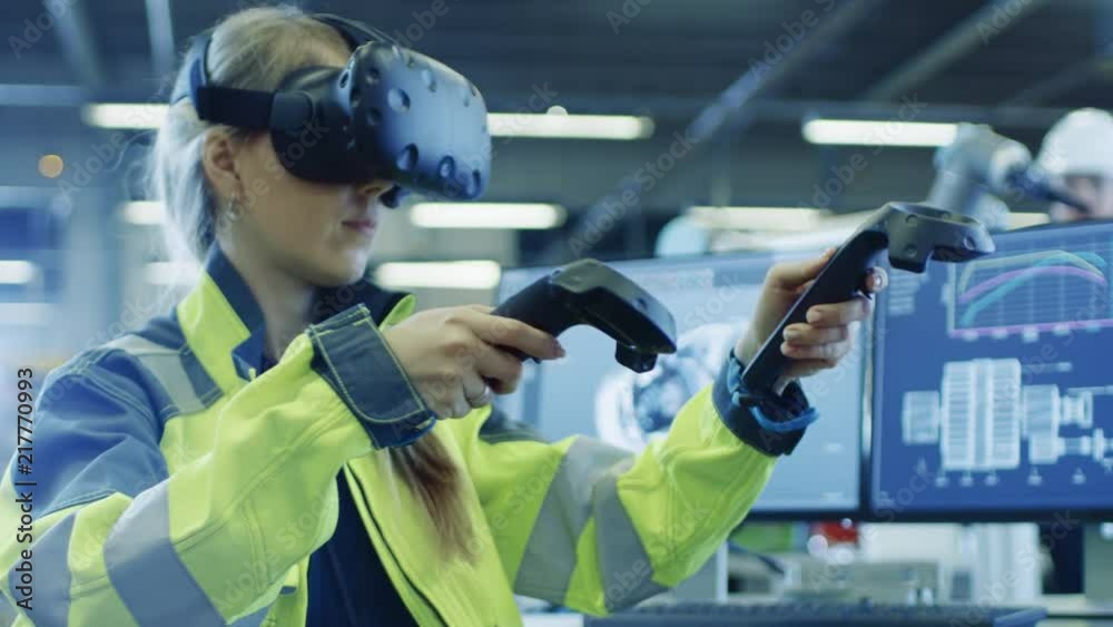 Poster factory: female industrial engineer wearing virtual reality headset and holding controllers, she use