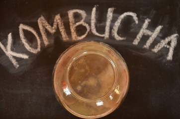 fermented drink, jun tea healthy natural probiotic in a glass jar.