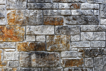 Wall background with various sized stone slabs