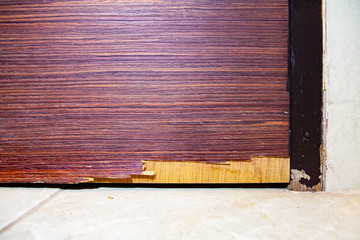 Typical home improvement problem. Miserable, Chipped and damaged skin of wooden veneer door. Cause...