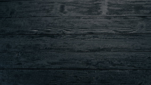 Old vintage wooden black background. Top view. Free space for your text.