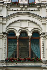 Close-up of a luxury window in arches on white wall