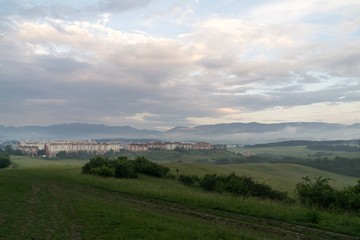 Obraz premium Sunrise and sunset over the hills and town. Slovakia