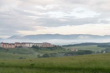 Obraz premium Sunrise and sunset over the hills and town. Slovakia