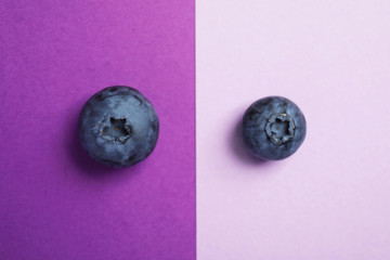Flat lay composition with tasty blueberry on color background