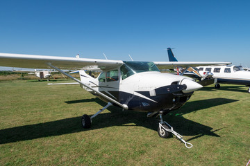 a variety of airplanes on the field