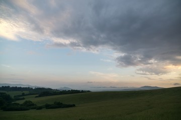 Obraz premium Sunrise and sunset over the hills and town. Slovakia