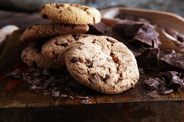 Chocolate cookies on wooden table. Chocolate chip cookies shot