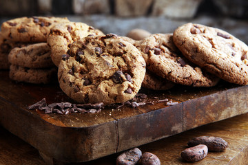 Chocolate cookies on wooden table. Chocolate chip cookies shot