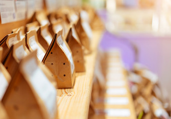 Brown paper food bag packages on wooden shelf