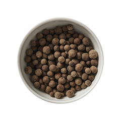 Allspice in bowl. Preparing ingredients for cooking. Isolated on white background. Top view.
