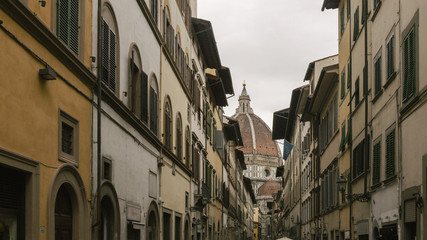 Fototapeta na wymiar Street of Florence, Italy with the Dome of the Florence Cathedral