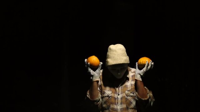 Ghost mim with pumpkins looks around and looks around