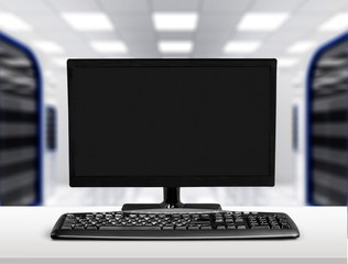 Desktop computer and keyboard on digital background