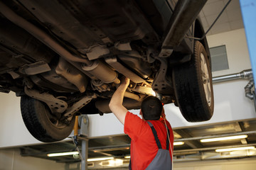 Portrait of a mechanic at work in his garage