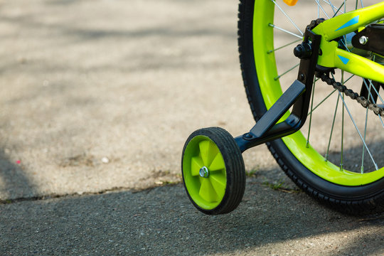 safety wheels on a bicycle closeup