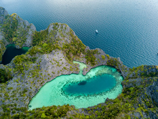 Aerial drone view of a beautiful coral lagoon inside a remote tropical island (Shark Lagoon, Cock...