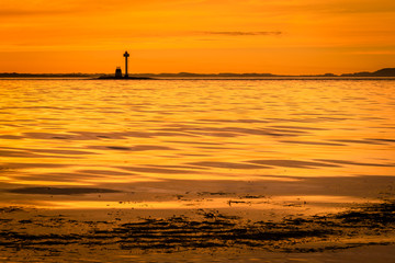Yellow sunset along the coastline 