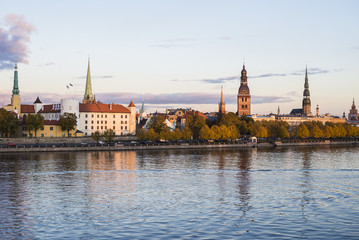 A view of the Old Town from the Daugava River promenade at sunset. Riga, Latvia © Alex Stemmer