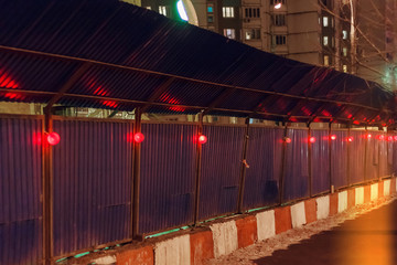 Bright red construction lamp on the construction