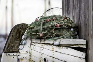 Fish trap on display on part of old wooden boat 