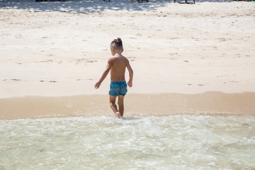 little boy in the sea in Thailand