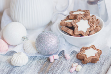 Cup of cacao with marshmallow, cookies, meringues and different Christmas decorations