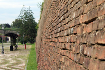 Side view of red brick wall