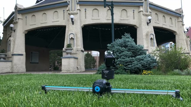 Motion slider time lapse pan camera in action in park