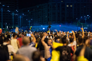 Romania, Bucharest - August 10, 2018: Police using water canons to split the crowd protesting anti PSD government - obrazy, fototapety, plakaty