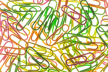 Composition of colored paper clips white isolated