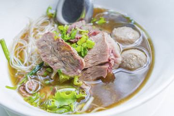 Beef noodles with braised beef and meatball delicious Chinese style Asian favorite Thai street food.