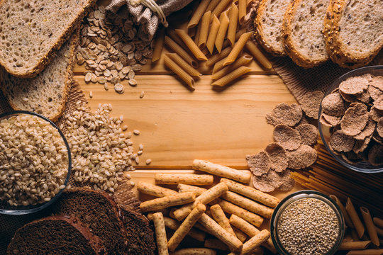 Frame with best know Whole-grain foods on a wooden table