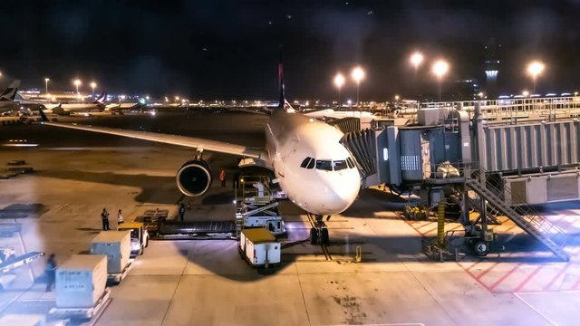 4k time lapse, Unloading airplane cargo air freight logistic background at hong kong.